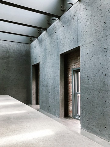 Industrial concrete wall interior design by Aadya Interiors & Infrastructure showcasing modern, durable and functional interior solutions in Hyderabad.